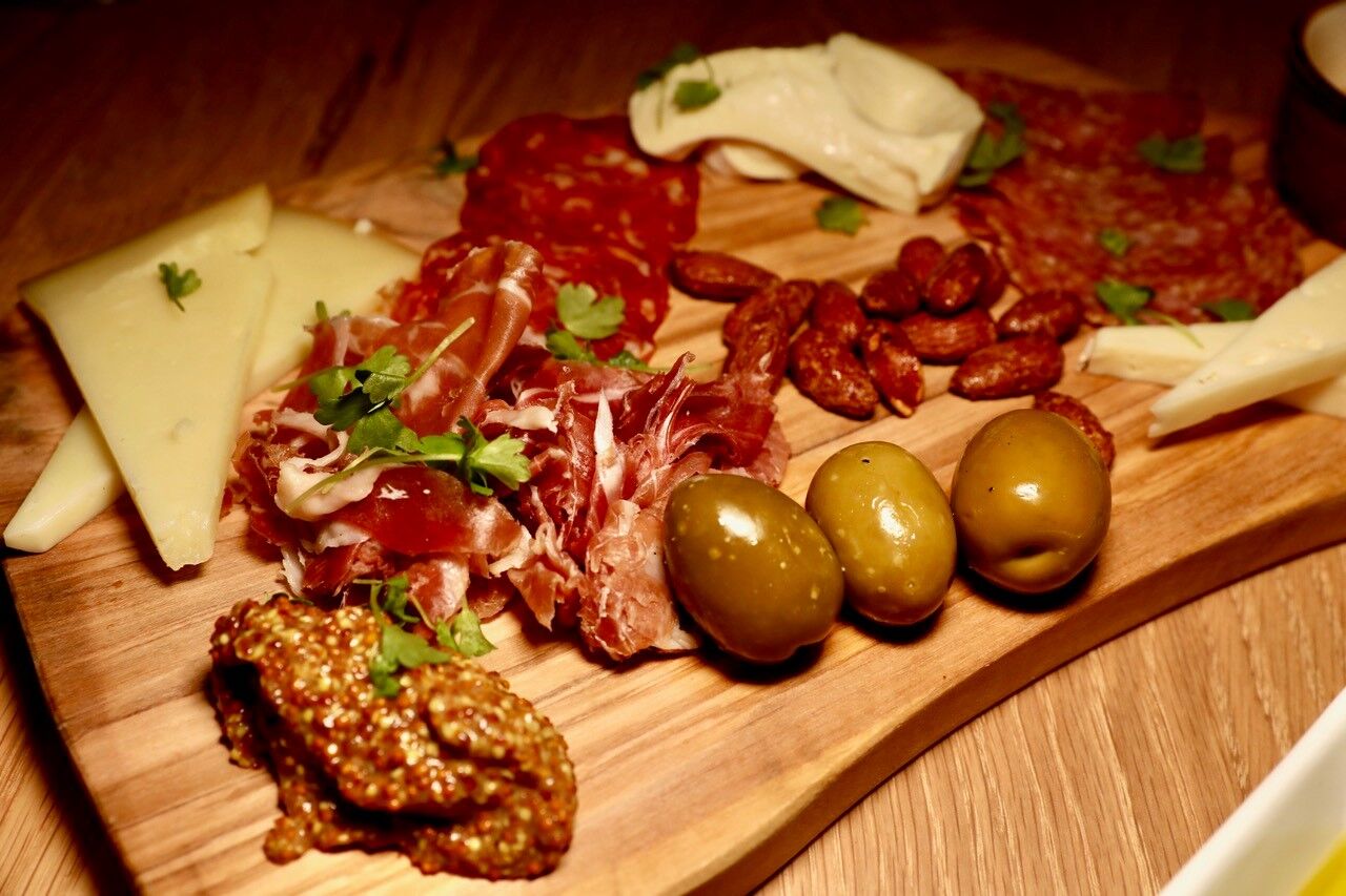 A colorful charcuterie plate at Serena Pastificio.